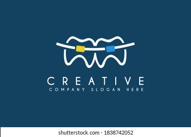 Dental braces logo design vector illustration. Dental braces icon. Suitable for business and health care logos, isolated on blue background