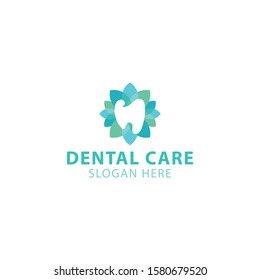 The dental care logo with the shape of the teeth between fresh colorful leaves makes this design unique, modern, luxurious.