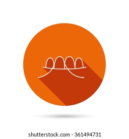 Dental floss icon. Teeth cleaning sign. Oral hygiene symbol. Round orange web button with shadow.