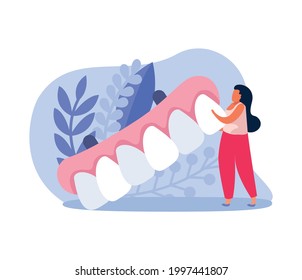 Dental health icon with tiny woman holding dental prosthesis vector illustration