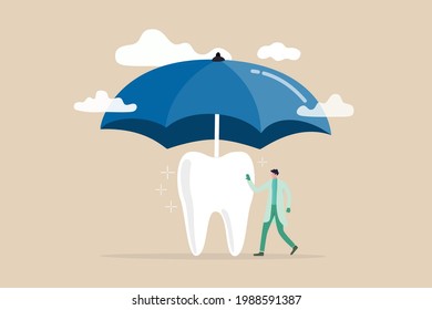 Dental Insurance Covering Healthcare And Medical Cost, Tooth Protection Or Dental Care Concept, Dentist Standing With Strong Clean Tooth With Big Umbrella Cover Or Protect From Storm Above.