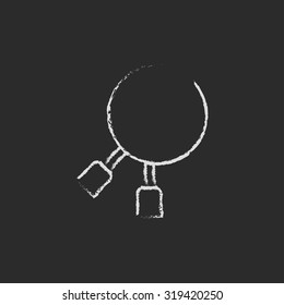 Dental pliers hand drawn in chalk on a blackboard vector white icon isolated on a black background.