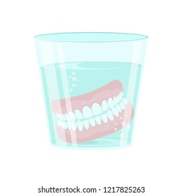 Dental prosthesis in a glass beaker with a special solution. Denture in a glass beaker Vector illustration