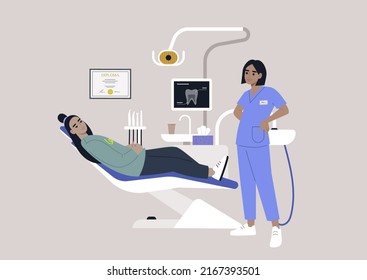 A dentist chair and tools, a monitor with an x-ray image, drills and other instruments in a stomatology cabinet