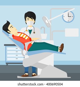 Dentist and man in dentist chair.