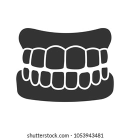 Dentures glyph icon. False teeth. Human jaw with teeth model. Silhouette symbol. Negative space. Vector isolated illustration