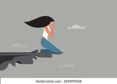 A depressed girl weeping on the edge of a cliff - Shutterstock ID 1833993358