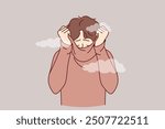 Depressed man hides face behind collar of sweater, feeling shame of actions. Upset guy covers head with shame, trying to hide from others and public censure, causing stress and depression