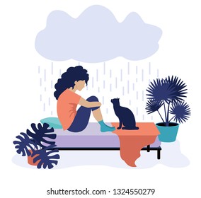 Depressed woman and cat. Sad woman in bed. Sad woman sitting on the bed. Depressive girl.