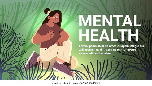 depressed woman sitting on ground in forest sad girl suffering from psychological diseases anxiety mental health awareness month concept