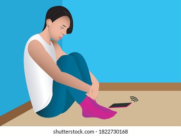 
Depressed young man sitting on the floor in his bedroom without answering the mobile phone