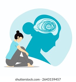 Depressed young woman sitting on floor and hugging knees due to thinking a lot. Depression, bipolar disorder, obsessive compulsive, post traumatic stress disorder.