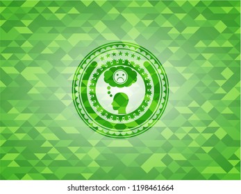 depression icon inside green emblem with mosaic background