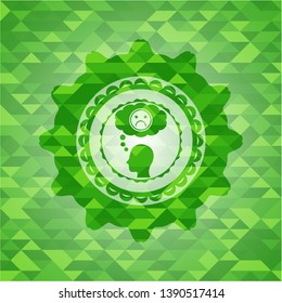depression icon inside green emblem with mosaic ecological style background