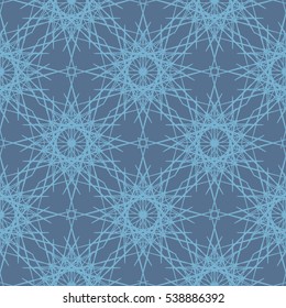 Desaturated blue lace snowflakes seamless pattern. Intricate winter ornament for website backgrounds. Vector