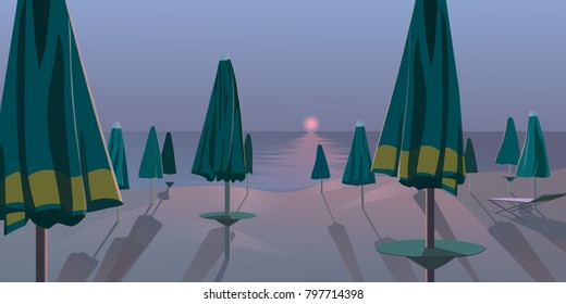 Desert beach landscape with soft sunset, many umbrellas and long evening shadows.