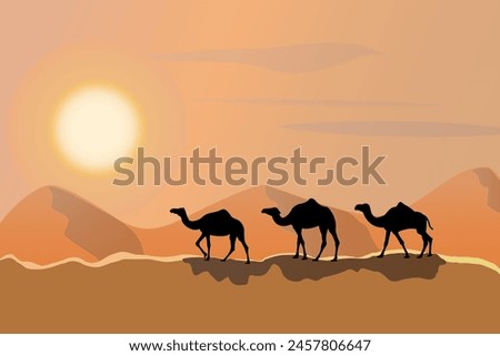 Desert camel caravan silhouette over the sunset or sunrise.