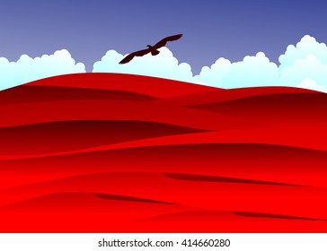 desert. Red dunes in the desert against blue clouds and the sky