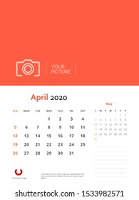 Design concept and idea layout April 2020 wall calendar stationary template. Corporate and business template design. Orange color and minimalistic style. Vector illustration. Isolated background.