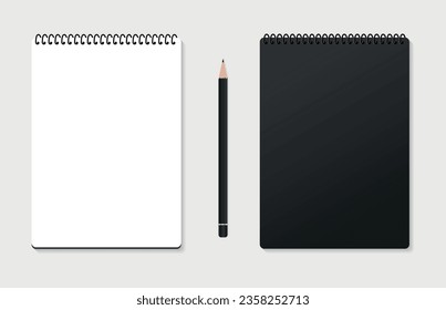 Design Concept - Top view of a black stylish spiral notebook with a black colored pencil isolated on a gray background for the layout