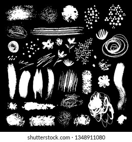 Design elements set, textures. Shapes, spots, brush strokes, flowers, lines, dots. Sketch, hand drawn isolated on black background