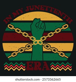 The design features a raised green fist breaking free from chains, set against a backdrop of horizontal stripes in red, yellow, and green, with the text "IN MY JUNETEENTH ERA" arching above.