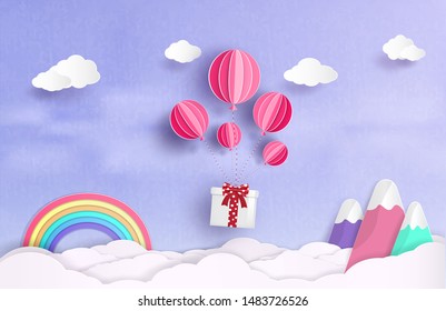 Design ideas and gifts that bind balloons floats in the sky.and There is a beautiful rainbow and a balloon tied to gifts and floating in the clouds.and origami or paper cut style design.and background