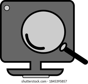 The design of a magnifying glass icon in front of the computer