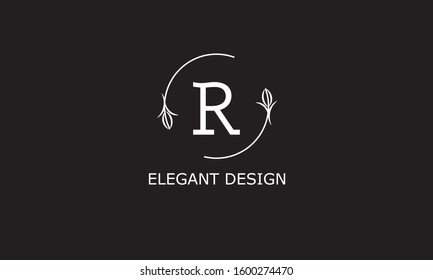 Design of modern monogram on black background with letter R. Vector floral logo.