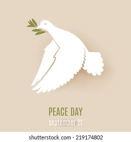 Design for Peace day with flying white dove with green twig in its beak