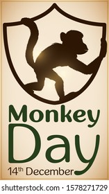 Design with primate silhouette inside a shield, symbolizing the promotion and protection of these animals during Monkey Day in December 14.