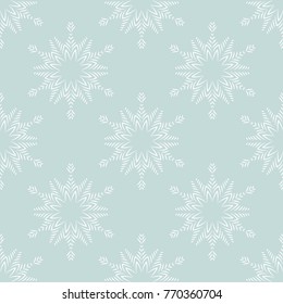 design of seamless pattern with white snowflakes on blue background