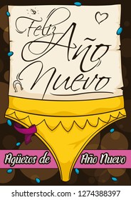 Design with sexy, yellow string with greeting scroll decorated with doodles, confetti shower, streamers and ribbon for Latin American omen for good luck in New Year celebration (written in Spanish).