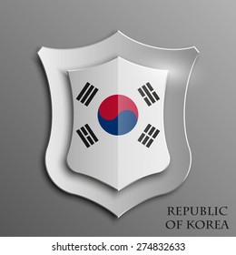 Design shield with flag and 3D effect on grey background - South Korea