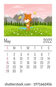 Design template. Calendar for 2022, May. Cute cartoon tiger sniffs flowers on the background of mountains and fields. Spring landscape. The symbol of the year. Animal character. Vector illustration.