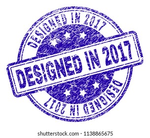 DESIGNED IN 2017 stamp seal imprint with grunge texture. Designed with rounded rectangles and circles. Blue vector rubber print of DESIGNED IN 2017 title with retro texture.