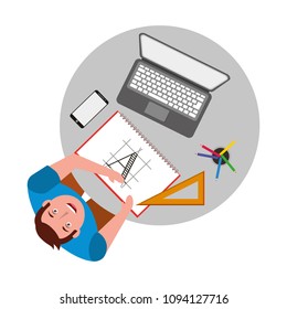 designer working at desk book laptop smartphone and ruler