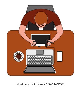 designer working on laptop using pen tablet mobile and coffee cup top view