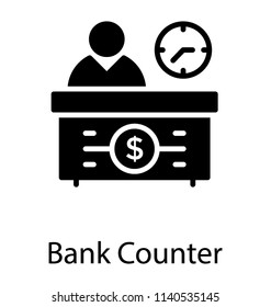 A desk having person and clock on wall with the dollar sign on table, bank counter 