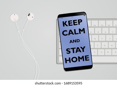 Desk with headphones, smartphone and keyboard with text keep calm and stay home