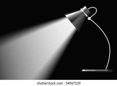 desk lamp with a black background, with a empty space under spotlight.