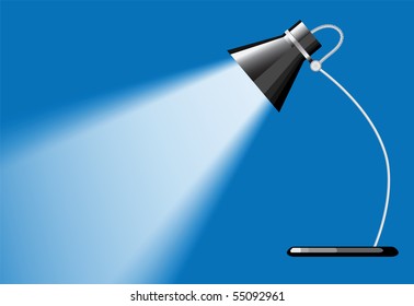 desk lamp with a blue background, with a empty space under spotlight.