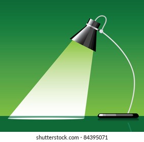 desk lamp with a green background, with a empty space under spotlight.