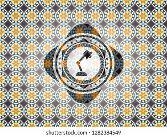 desk lamp icon inside arabesque style badge. arabic decoration.
