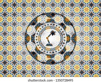 desk lamp icon inside arabesque emblem background. arabic decoration.