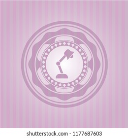 desk lamp icon inside badge with pink background