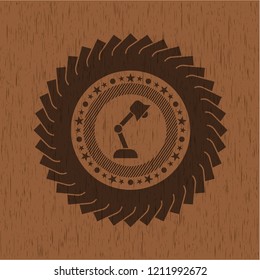 desk lamp icon inside badge with wood background