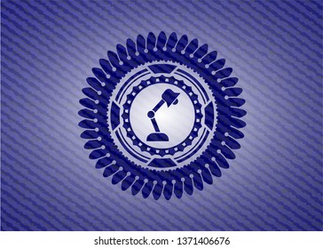 desk lamp icon inside badge with denim texture