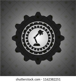 desk lamp icon inside black badge