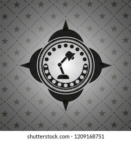 desk lamp icon inside black badge